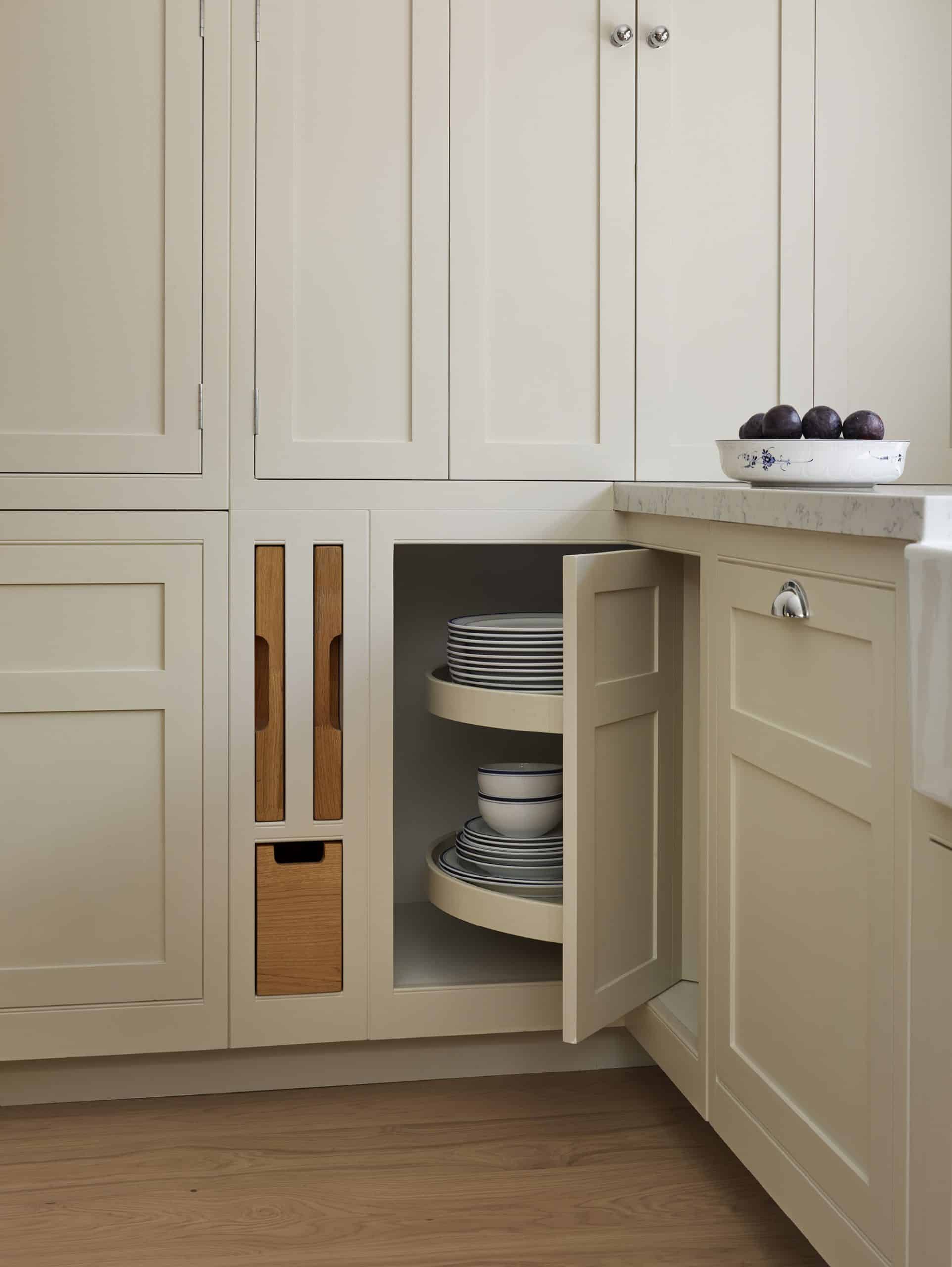 White integrated bin cupboard with light oak interior