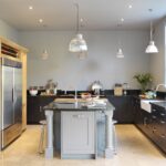 Dark grey Shaker kitchen cabinetry and oak housing