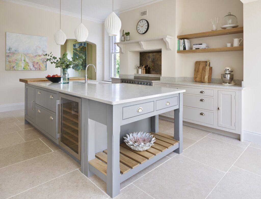 Grey Shaker kitchen island with marble worktop featuring wine storage