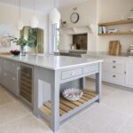 Grey Shaker kitchen island with marble worktop featuring wine storage