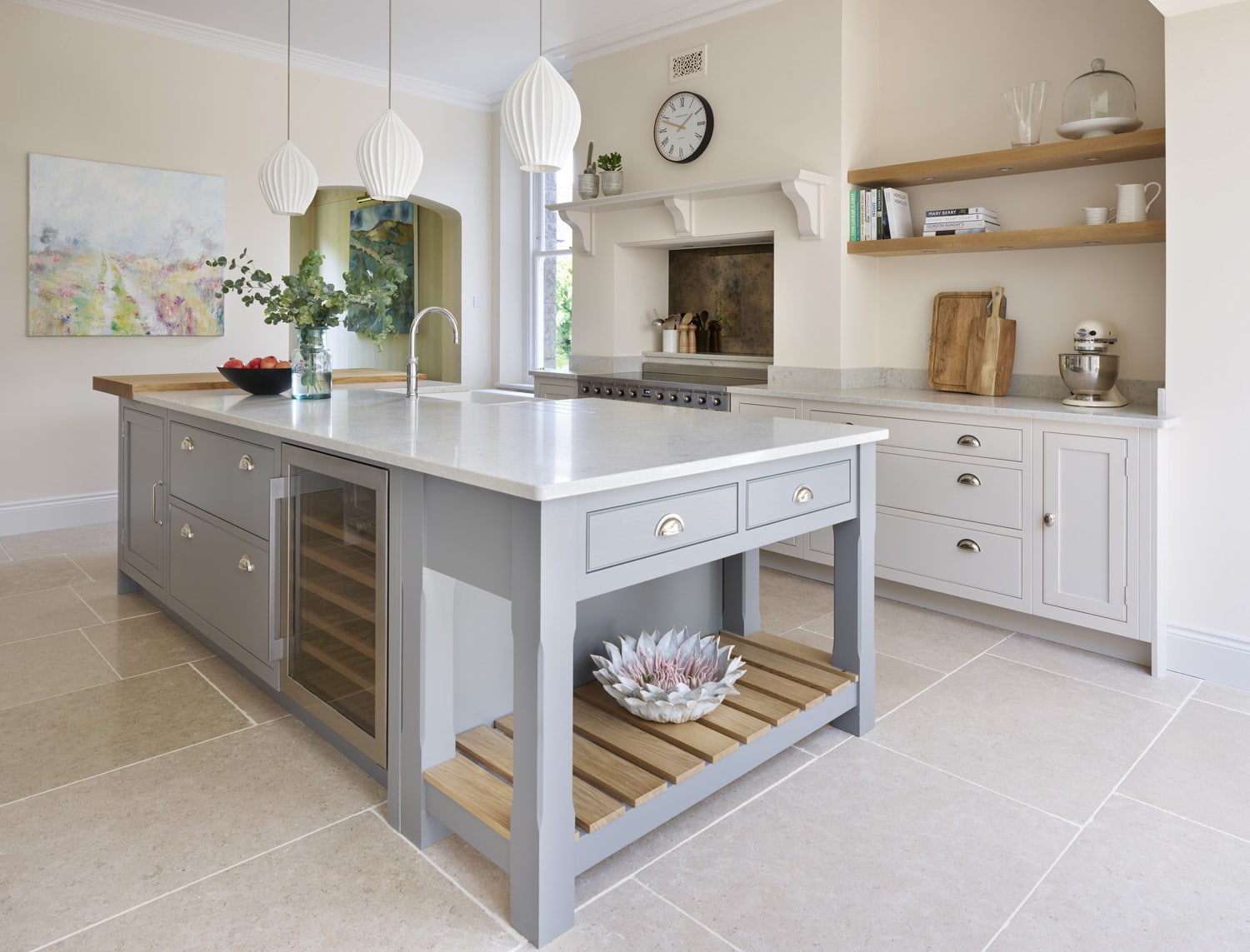 Grey Shaker kitchen island with marble worktop featuring wine storage