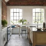 White Arbor kitchen cabinetry with an oak kitchen island with black worktop