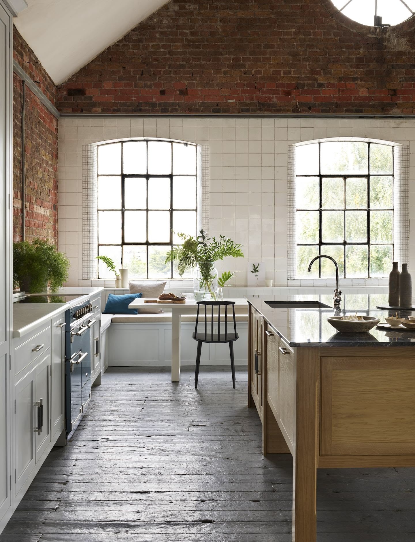 White Arbor kitchen cabinetry with an oak kitchen island with black worktop