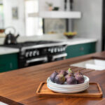 Walnut kitchen island with white Shaker end panel
