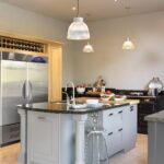 Grey Shaker kitchen island with Angola Blue granite worktop featuring integrated sink