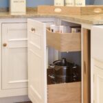 White integrated bin cupboard with light oak interior