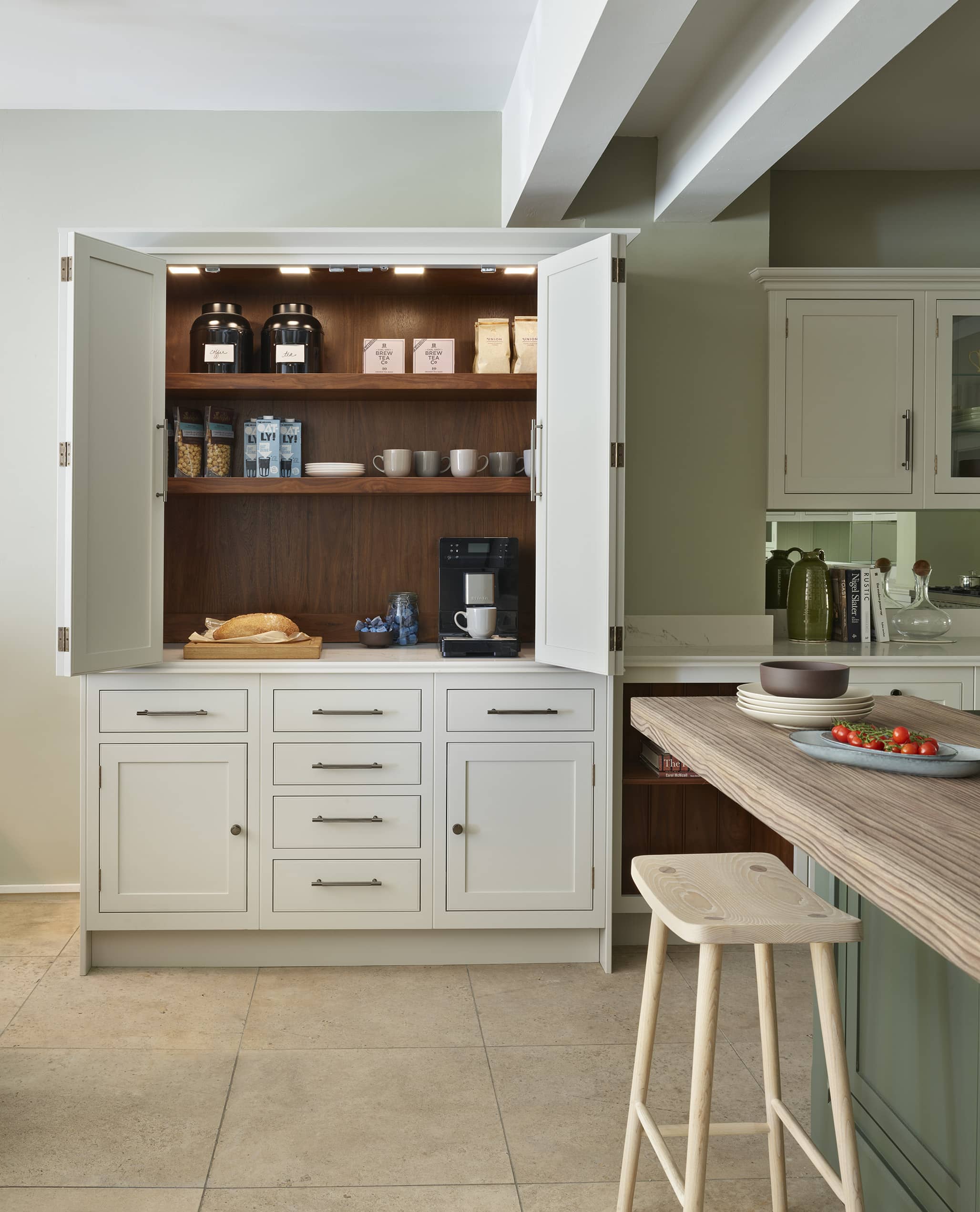 White Arbor kitchen cabinetry open to show organised storage