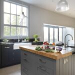 Grey Shaker kitchen island with Angola Blue granite worktop featuring integrated sink