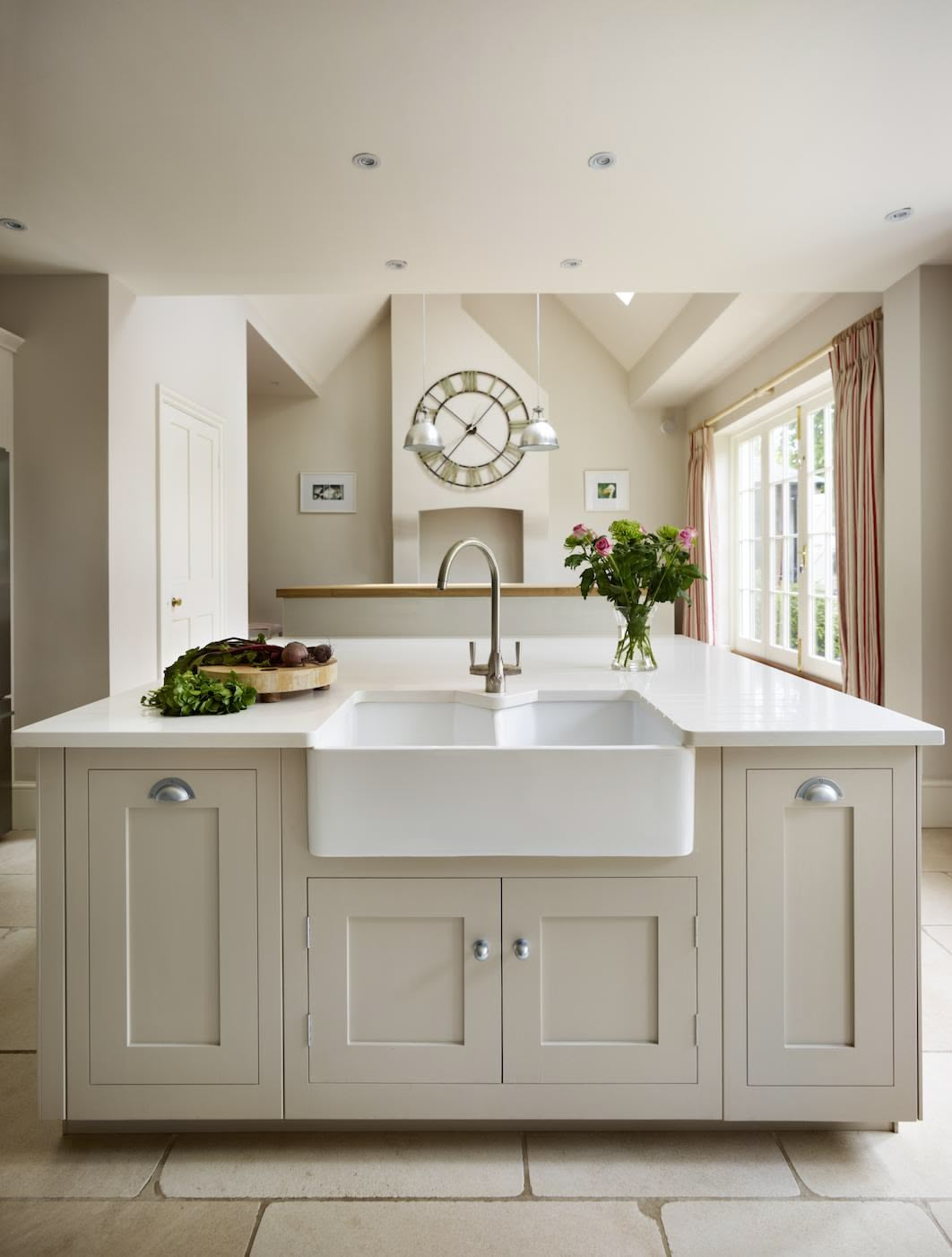 Beige Shaker kitchen island with integrated white basin sink