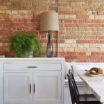 White Arbor kitchen cabinetry next to kitchen dining area