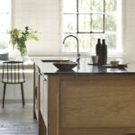 Oak kitchen island with black worktop