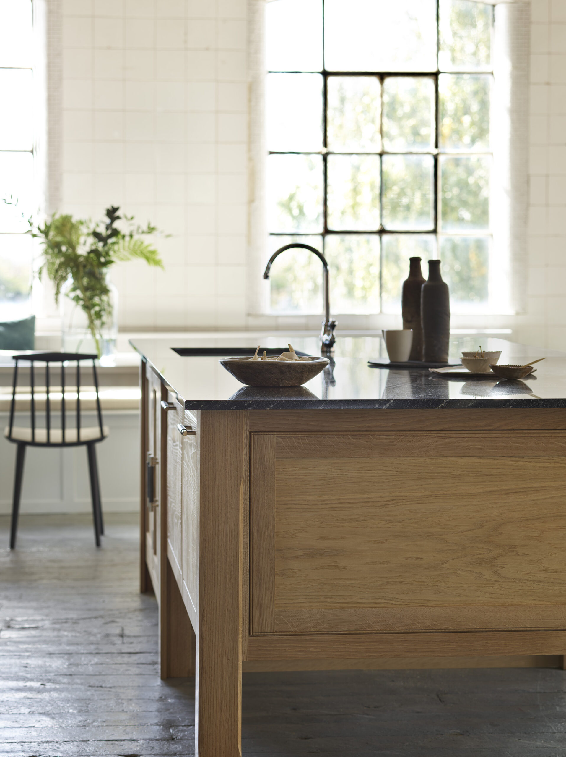 Oak kitchen island with black worktop