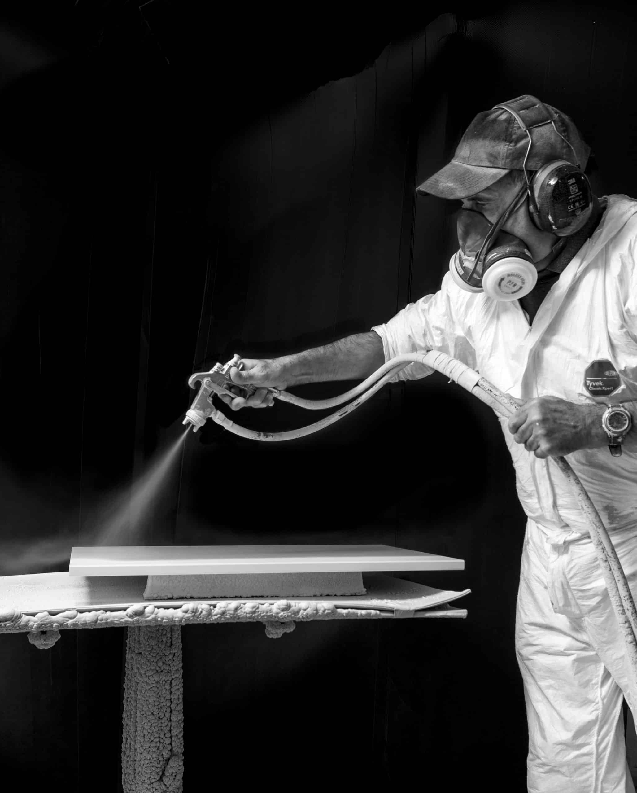 Primer being sprayed onto wood