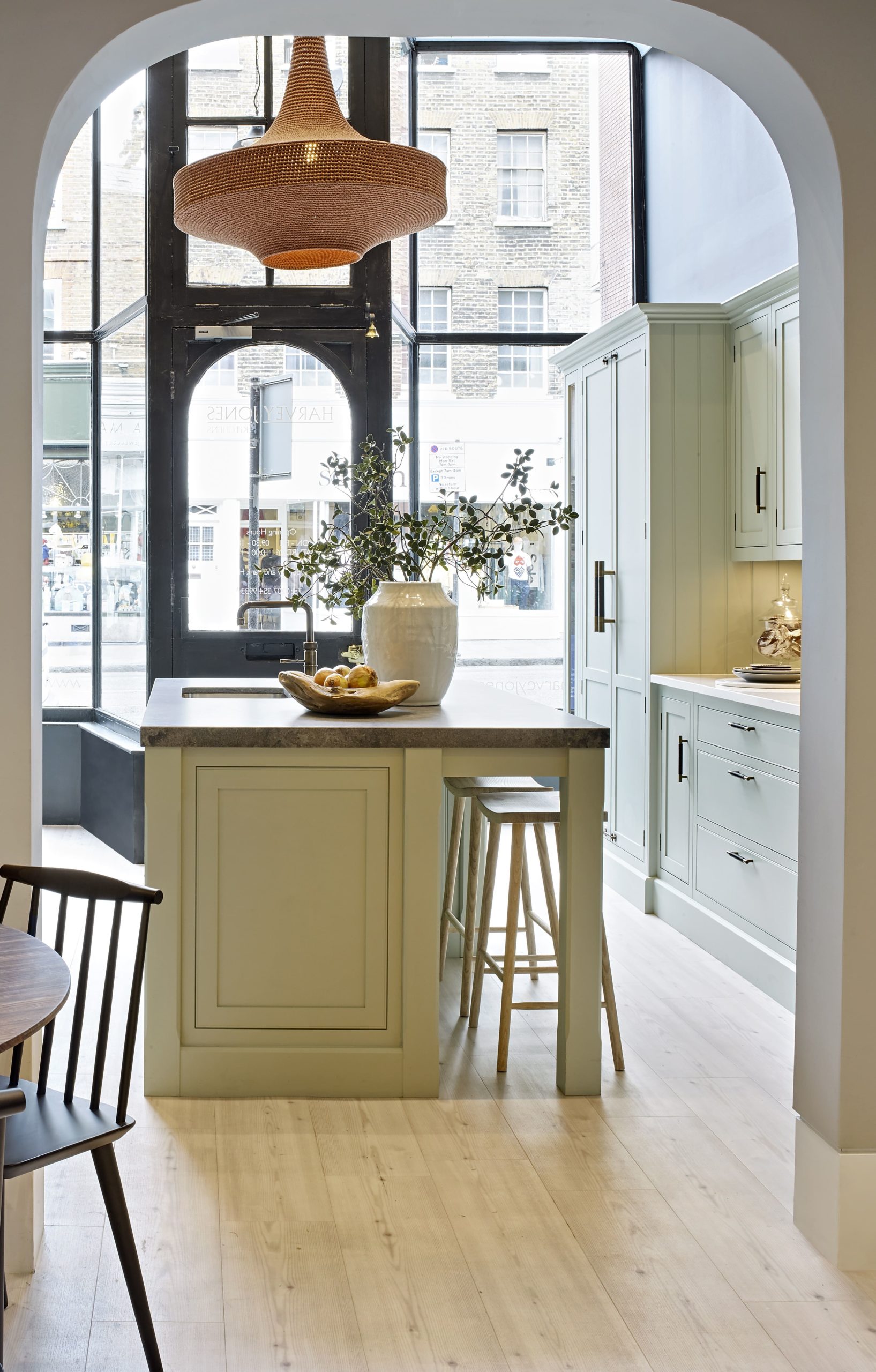 Harvey Jones showroom entrance with pale green kitchen design