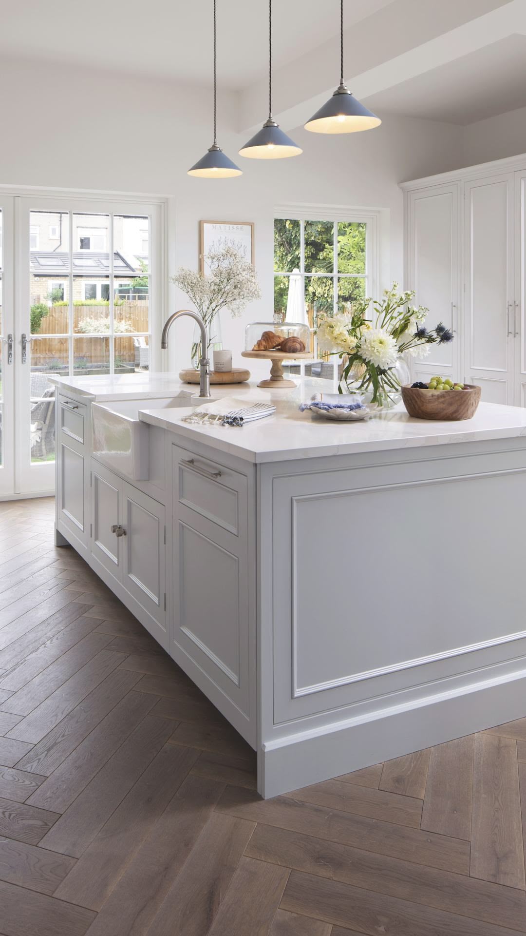 White kitchen island with white worktop