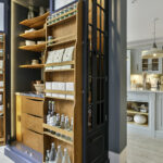 Harvey Jones end cabinet open to reveal organised storage
