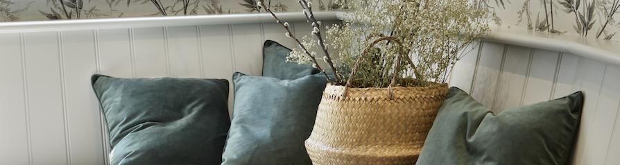 White corner bench seating with blue cushions
