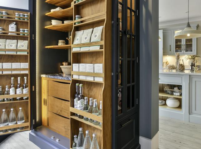 Kitchen pantry larder open to show organised storage