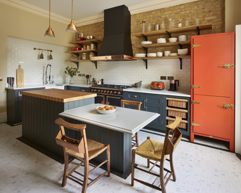 Dark kitchen island with oak worktop and dining extension