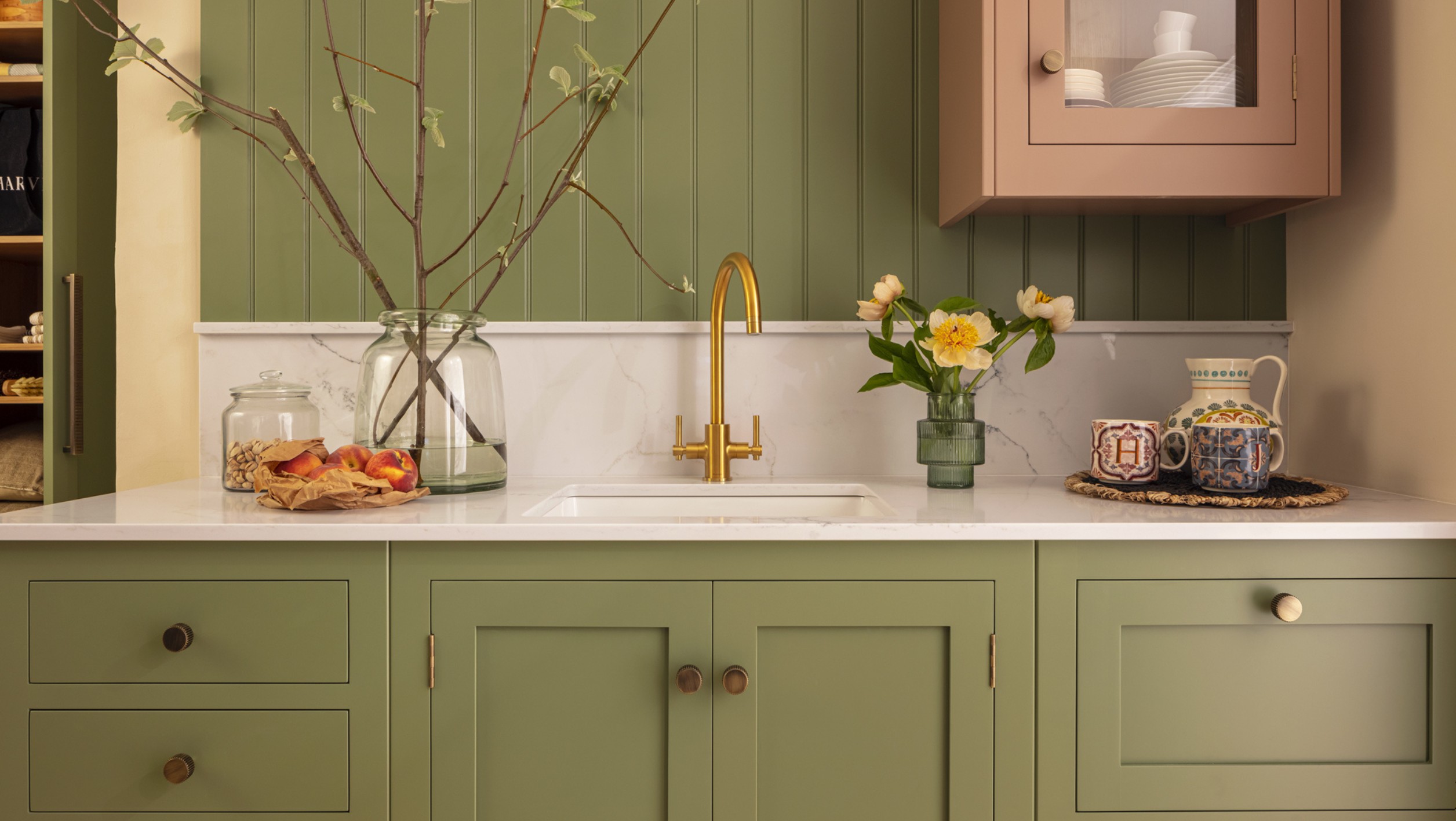 Harvey Jones Hampton kitchen design featuring green cabinetry and white worktops
