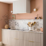Harvey Jones and Swoon kitchen design featuring reeded cabinetry with marble worktop and splashback