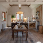 Longshot of an Arbor kitchen in a rectory renovation featuring a dining area