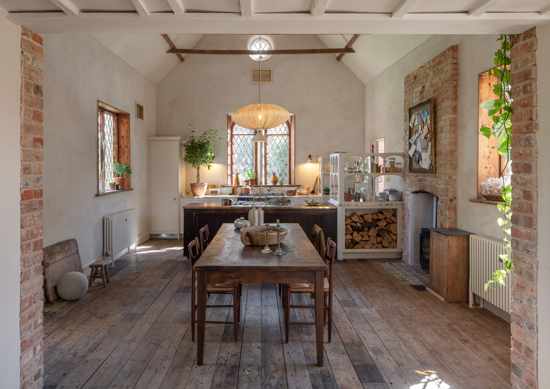 Longshot of an Arbor kitchen in a rectory renovation featuring a dining area