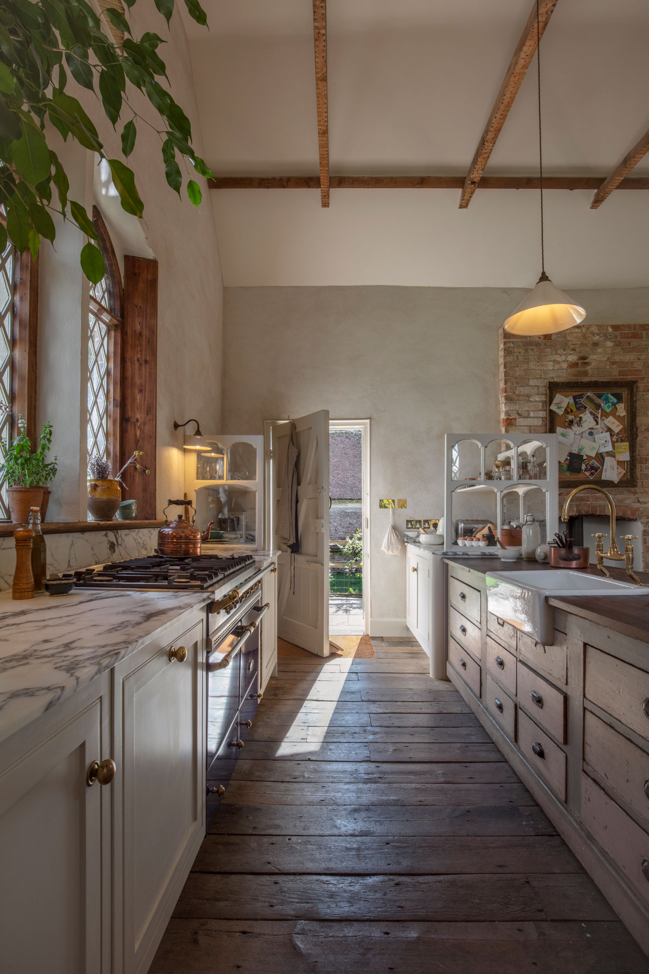 Narrow rectory kitchen featuring cream Arbor cabinetry