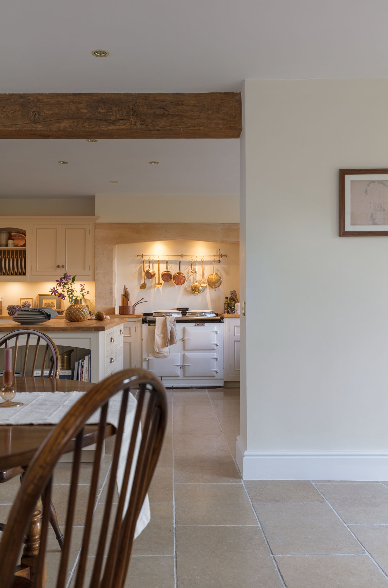White Original kitchen design viewed from open dining area