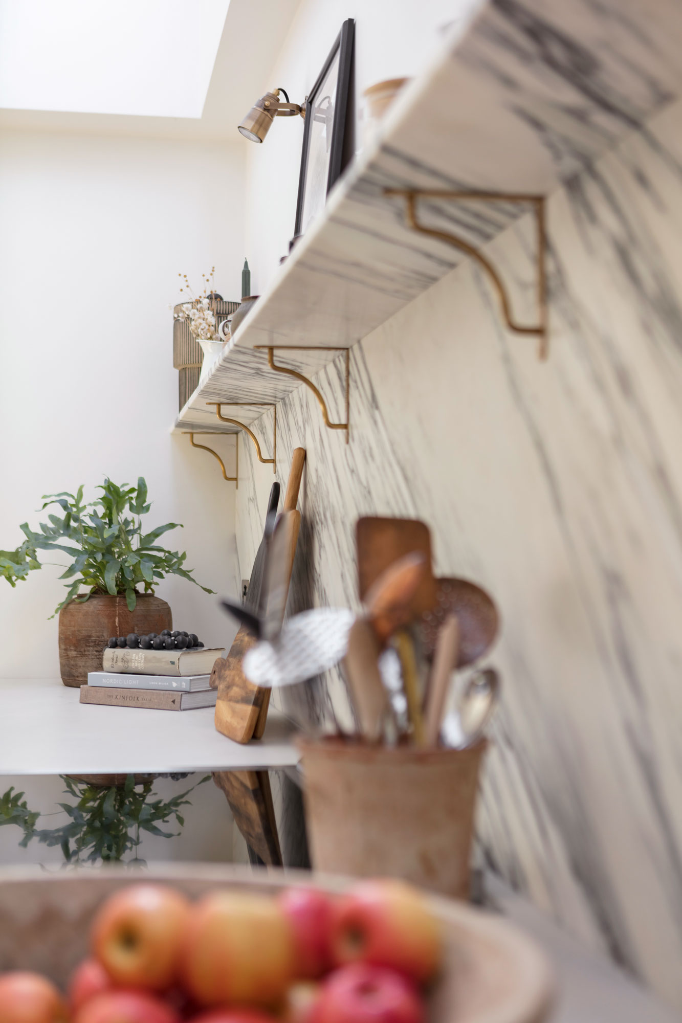 Closeup of marble kitchen splashback with marble shelving