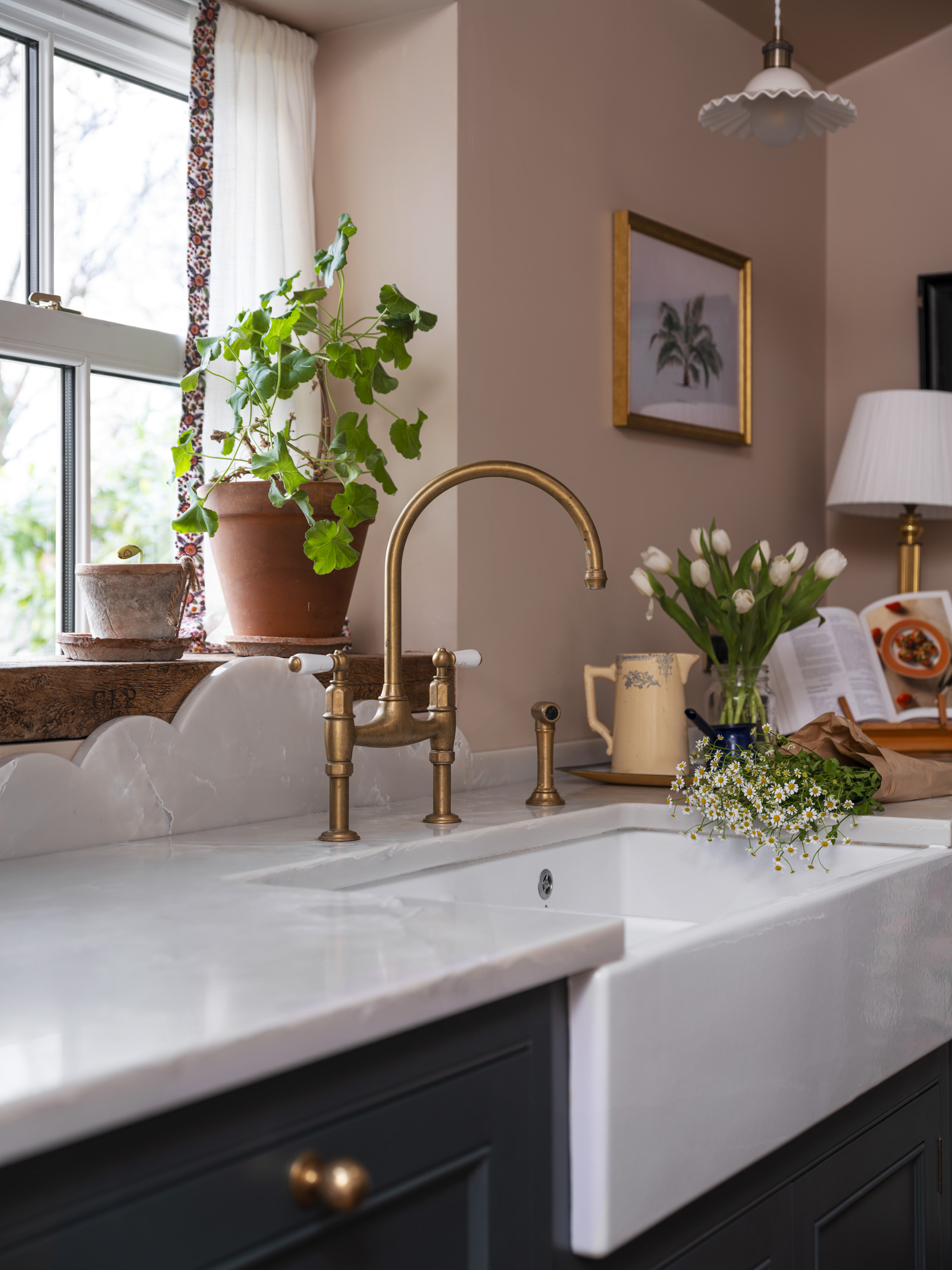 Teal Original kitchen cabinetry with white basin sink and brass tap
