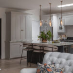 Light Shaker kitchen seen from open plan living area