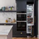 Kitchen appliances situated within dark Arbor kitchen cabinetry