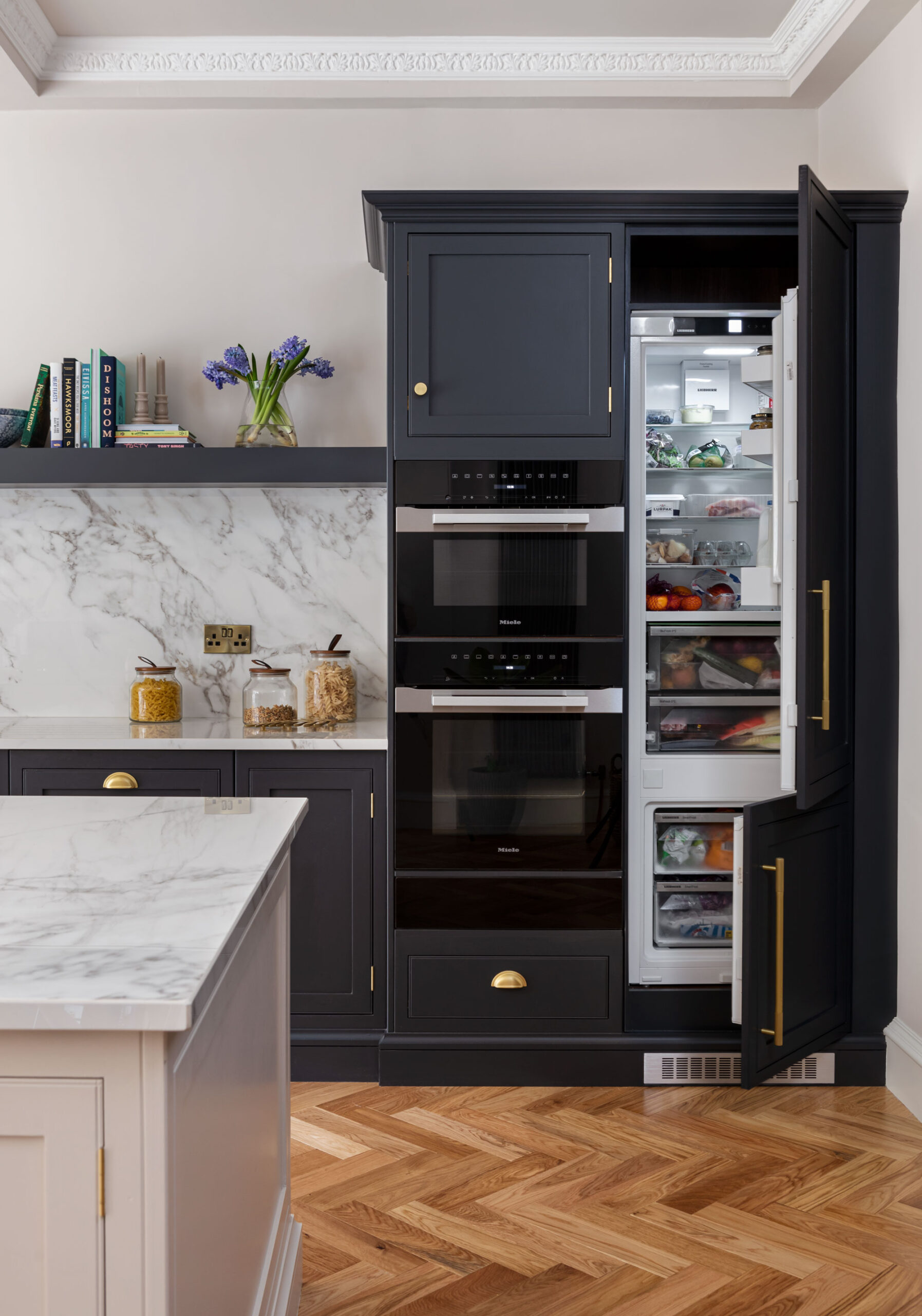 Kitchen appliances situated within dark Arbor kitchen cabinetry