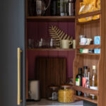 Closeup of black Arbor pantry with burgundy lining