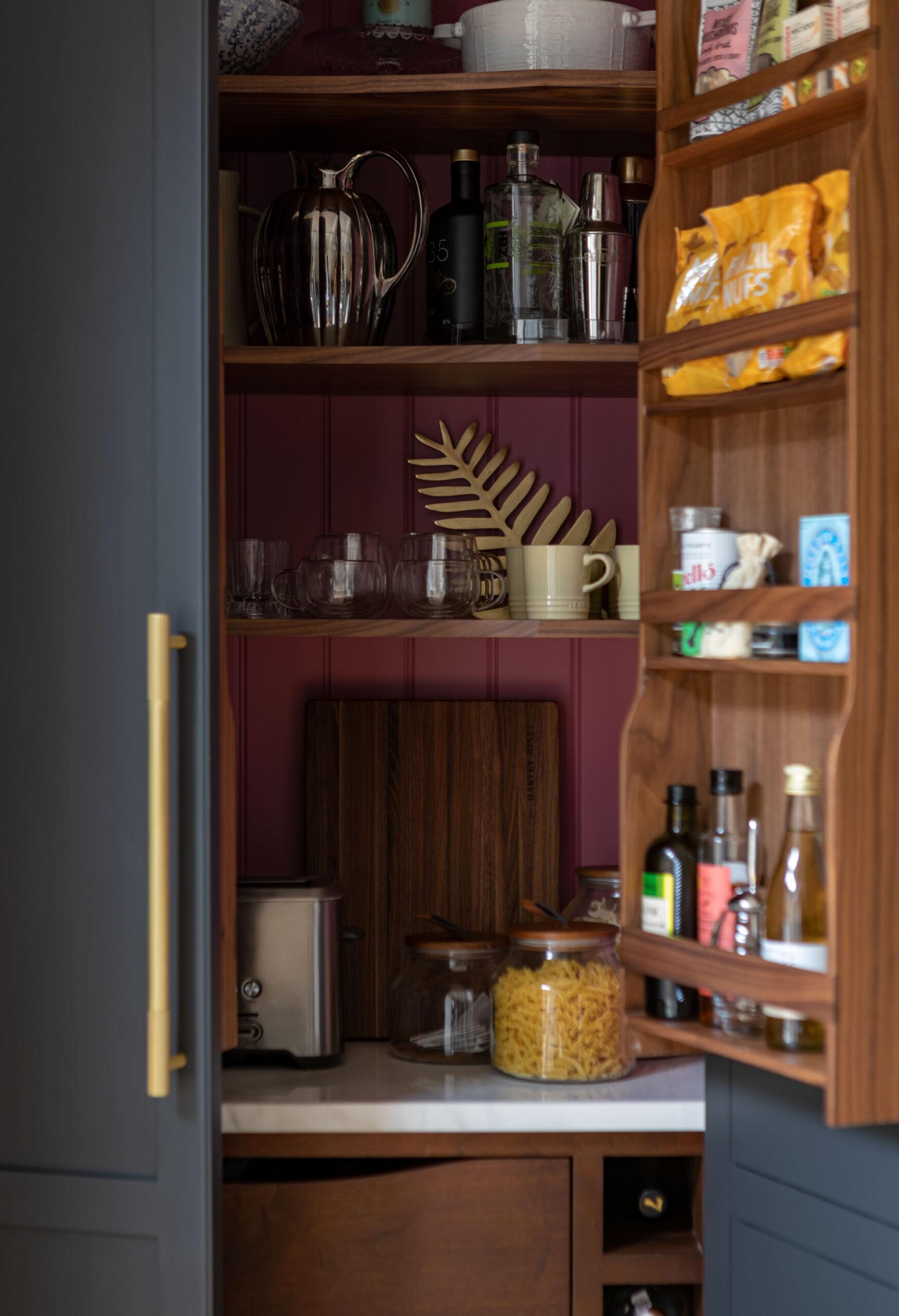 Closeup of black Arbor pantry with burgundy lining