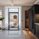 White marble kitchen island worktop with integrated hob