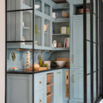Bespoke walk-in pantry with open shelving and ample kitchen storage solutions