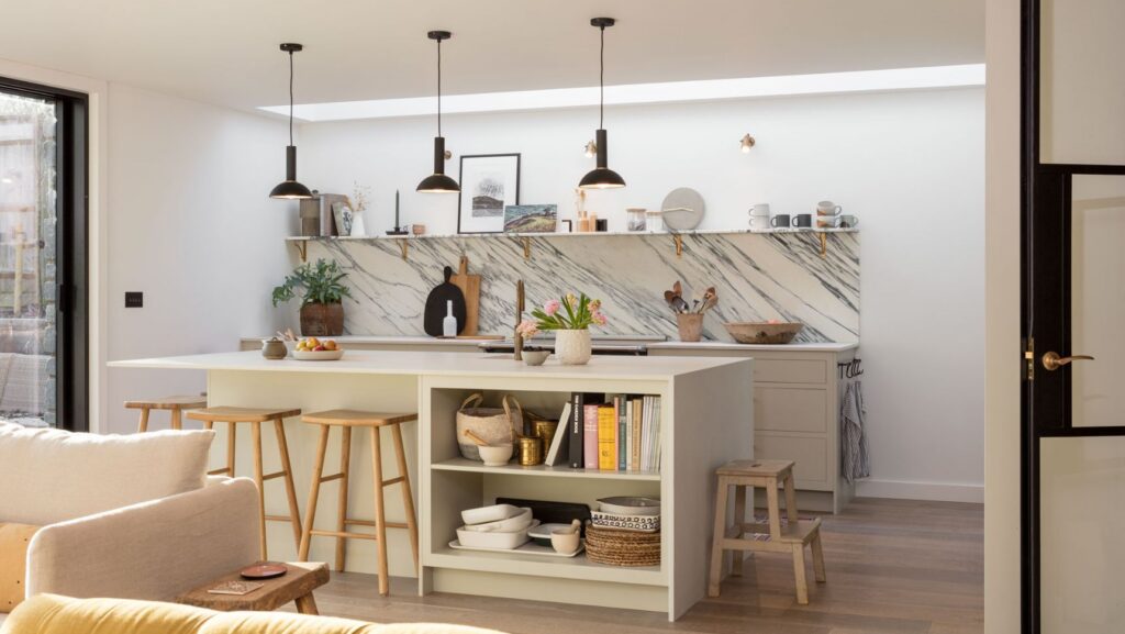 Scandi style kitchen design with island, open shelving and warm neutral colour palette