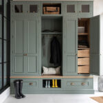 green luxury boot room with concealed drawer storage