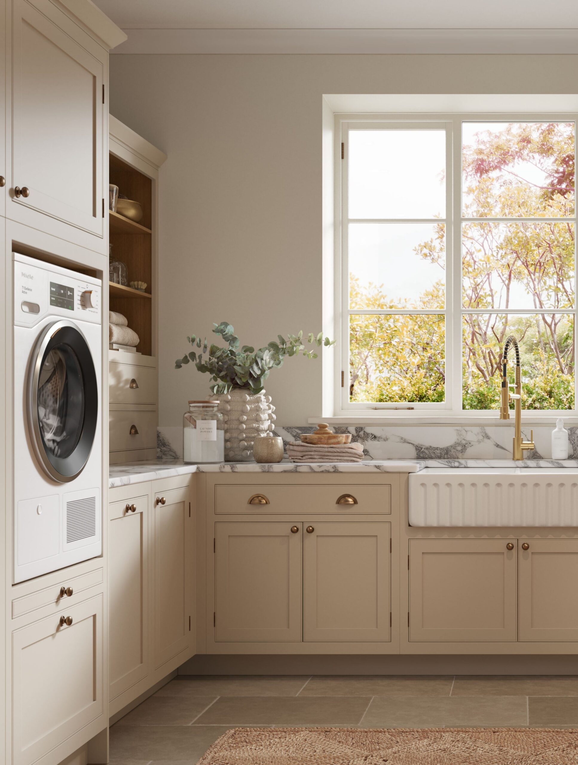 Utility room with beige cabinetry