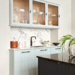 Harvey Jones X Swoon cabinetry featuring fluted glass revealing organised storage