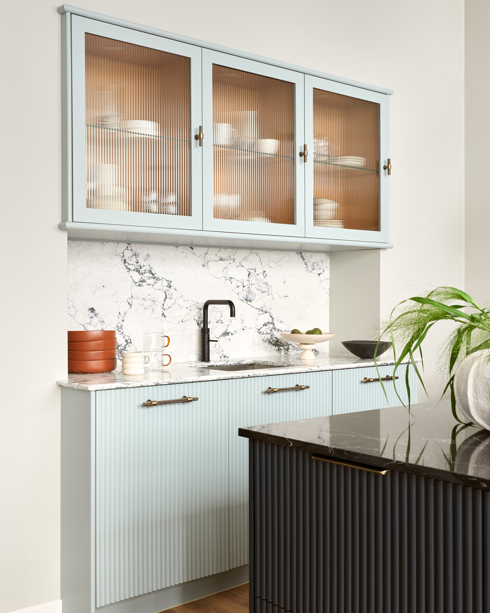 Harvey Jones X Swoon cabinetry featuring fluted glass revealing organised storage