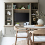 bespoke luxury media unit with marble table and chair in the foreground