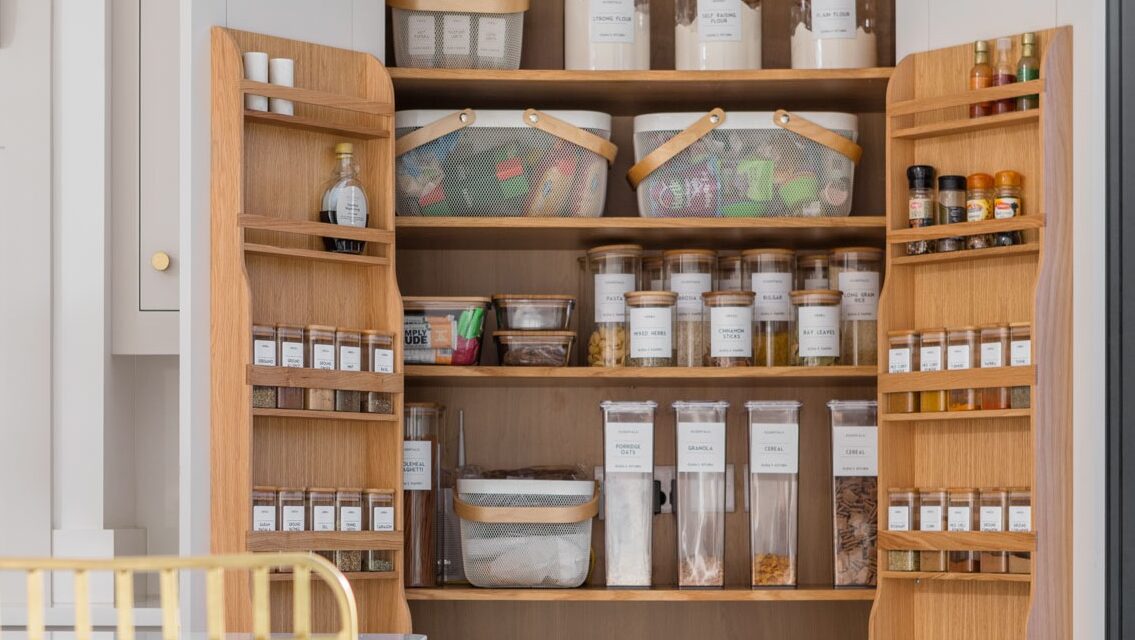 Organised pantry cupboard with bespoke storage, boxes and baskets