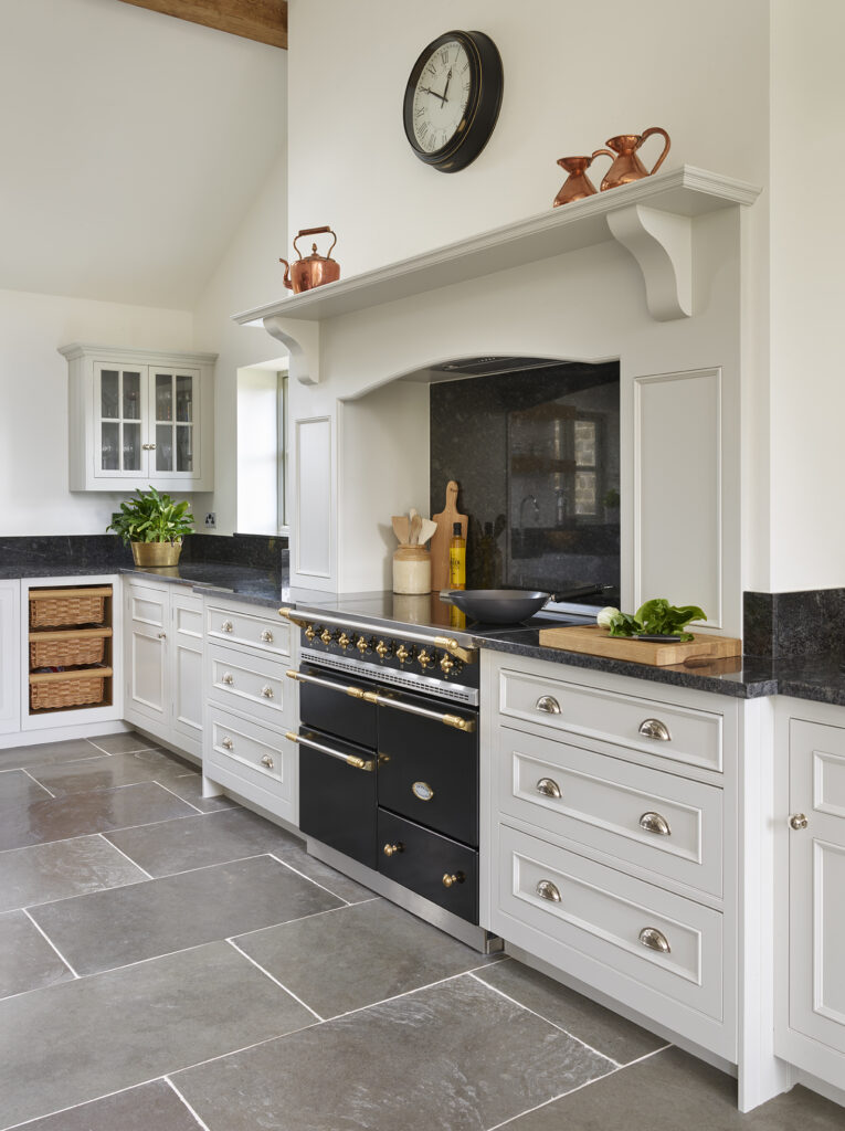 classic range cooker with in black with brass handles 