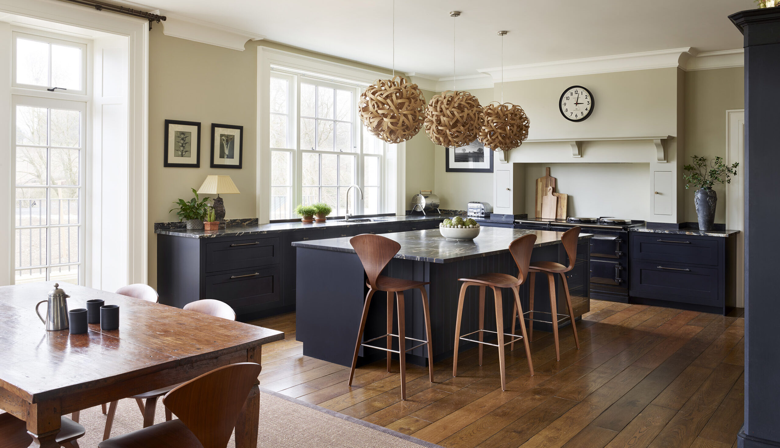 black shaker kitchen with dark wood features and walnut accents