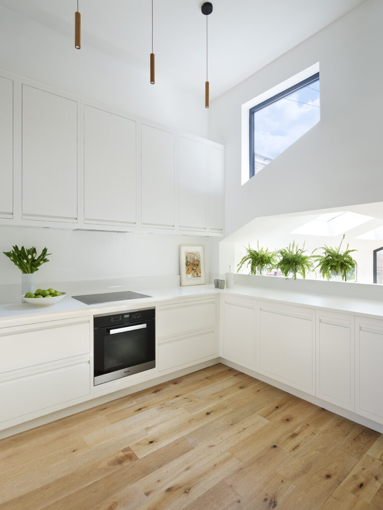 Minimal white kitchen with clean lines