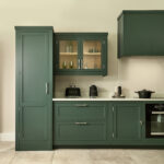 teal green harvey jones kitchen with slim larder to the left