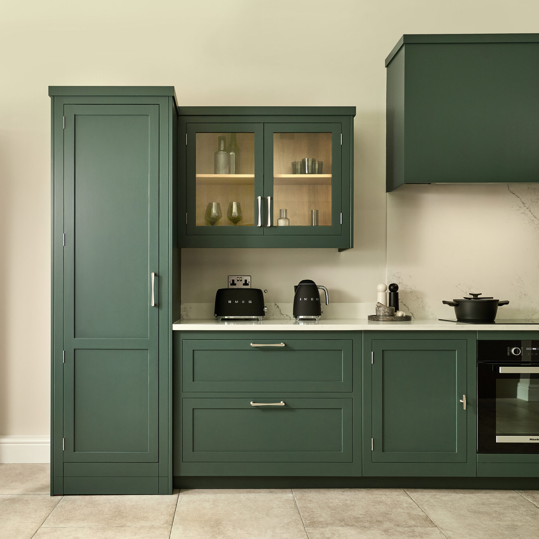 teal green harvey jones kitchen with slim larder to the left